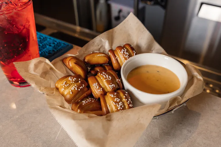 Pretzel bites and a drink at the bar